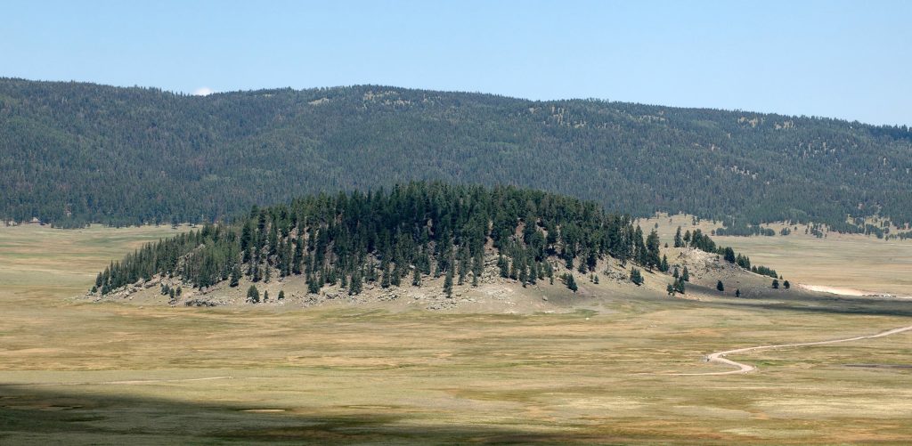 Sunset over volcanic peaks in Valles Caldera